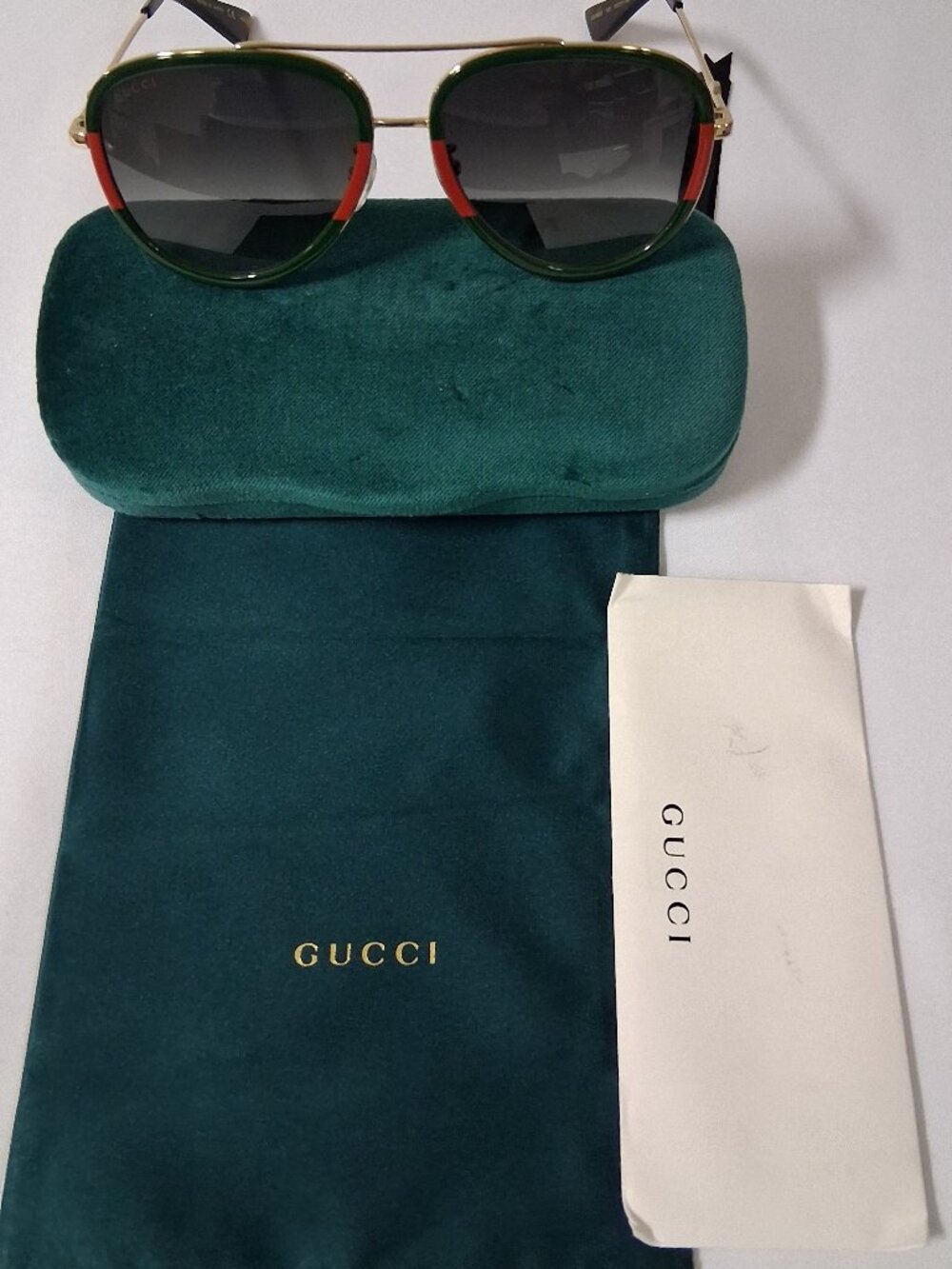 Authentic Gucci Pilot Urban Web Block Aviator Sunglasses in Gold/Green colorway.